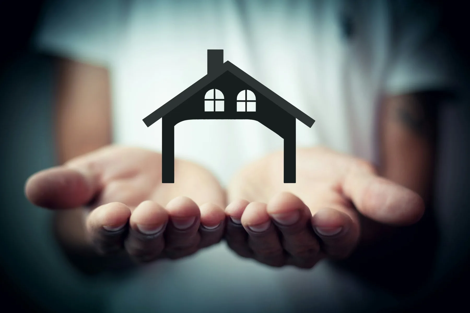 A house held in open hands