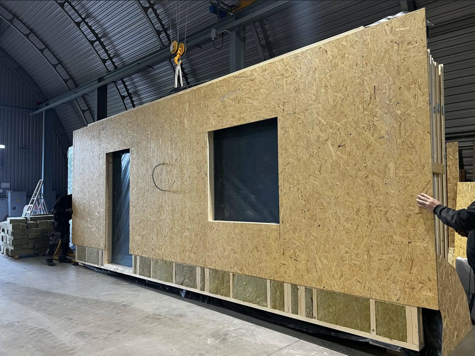 OSB-sheathed wall element on the crane